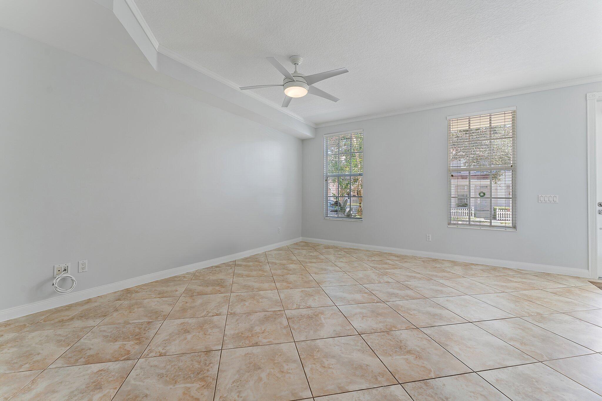 148 Middlebury Drive Jupiter, FL 33458 - Photo 8 of 32 a view of an empty room with a window