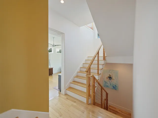 a view of a terrace with couches and wooden floor
