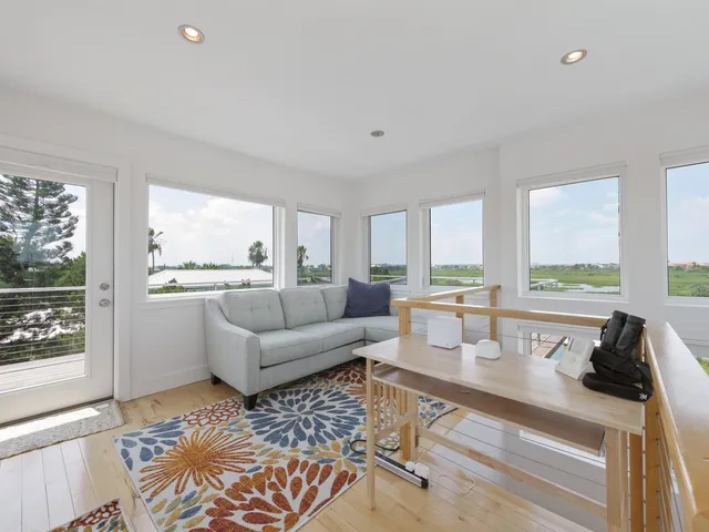 a aerial view of a house with a yard