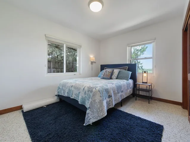 a view of a house with sitting area and garden