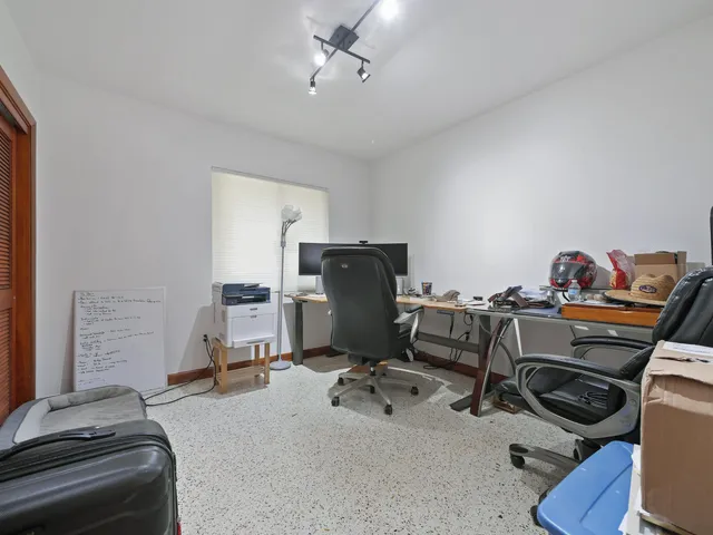 a front view of house with a garden