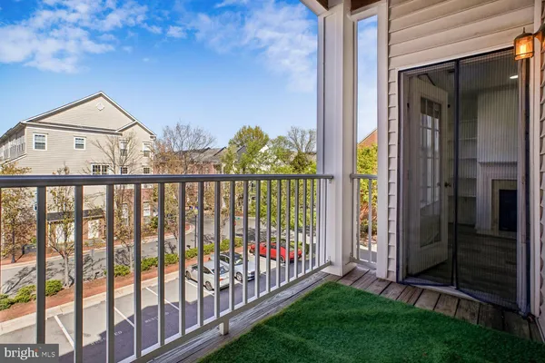 a front view of a building with a yard