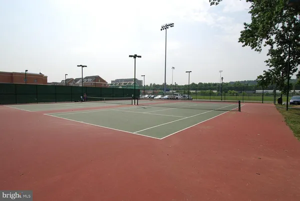a view of a chairs and table in the backyard