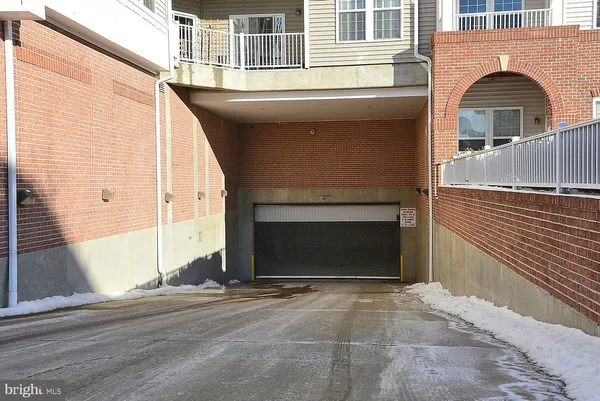 a view of a brick house with a large windows