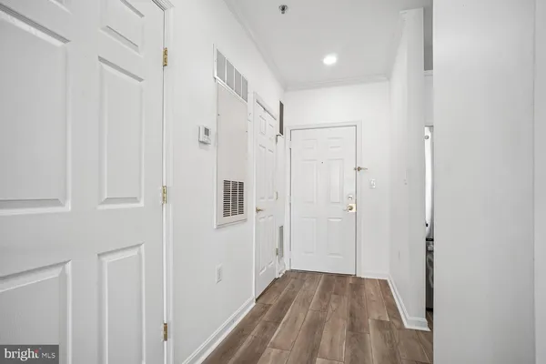 a view of a kitchen from the hallway
