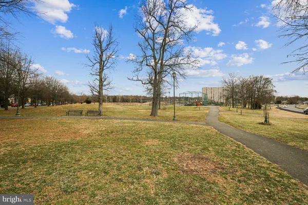 a view of a lake with houses in the back