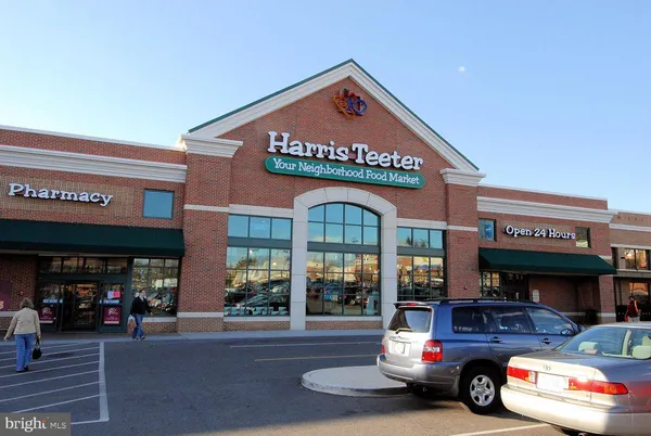 a view of a park with slide and a bench