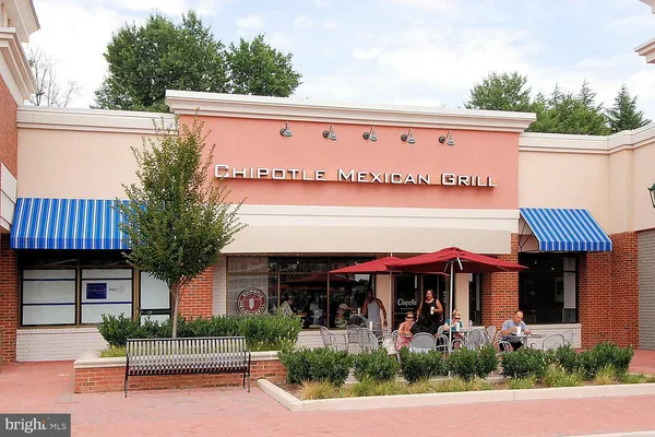 a view of a patio with table and chairs and a fire pit