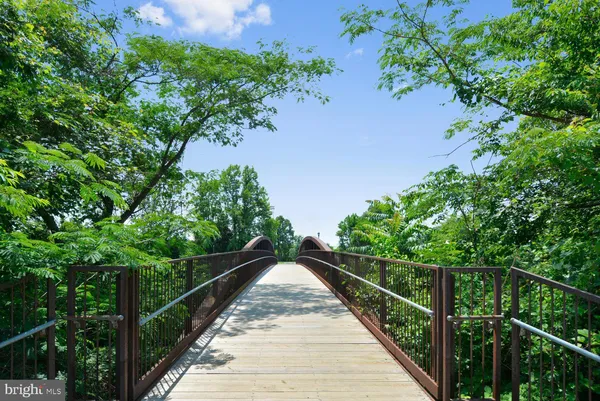 a view of a brick building next to a yard