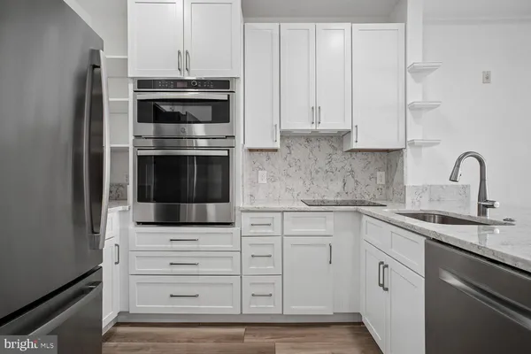 a kitchen with appliances and cabinets
