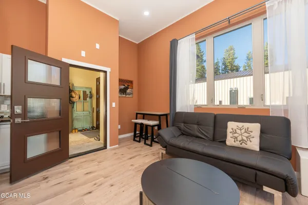 a kitchen with a refrigerator and a sink