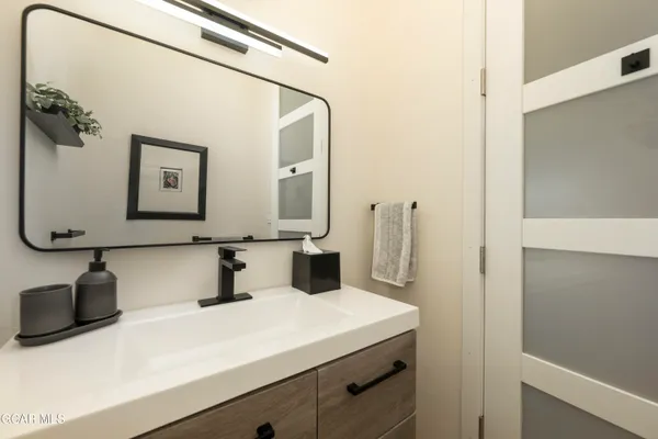 a large living room with stainless steel appliances kitchen island granite countertop a large counter top stainless steel appliances and cabinets