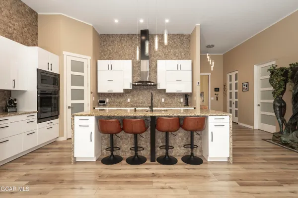 a living room with fireplace furniture and a wooden floor