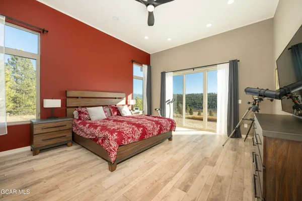 a living room with a bed and furniture