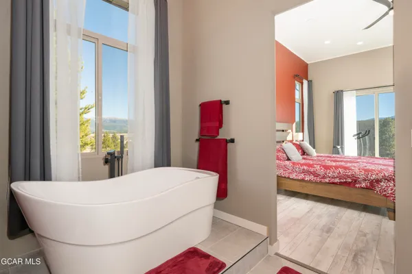 a bathroom with a shower and a glass door