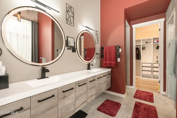 a bedroom with a bed and a desk