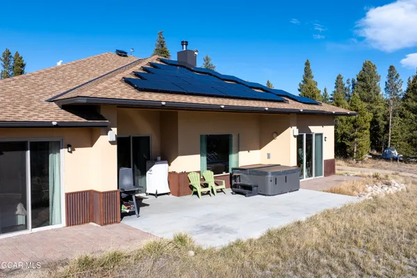 a room with table chairs and wooden floor