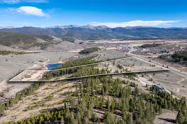 a swimming pool with outdoor seating and trees