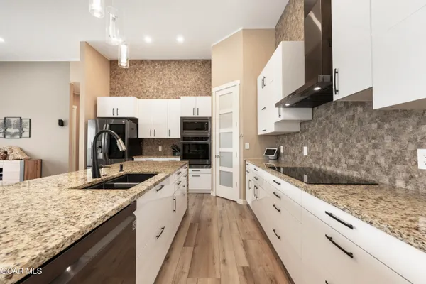 a living room with furniture window and wooden floor