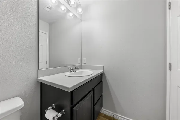 a bathroom with a sink and a toilet