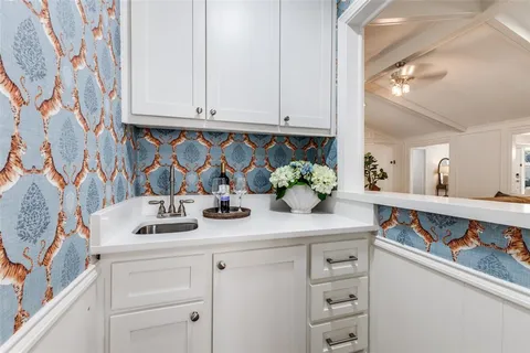 a kitchen with cabinets and white appliances