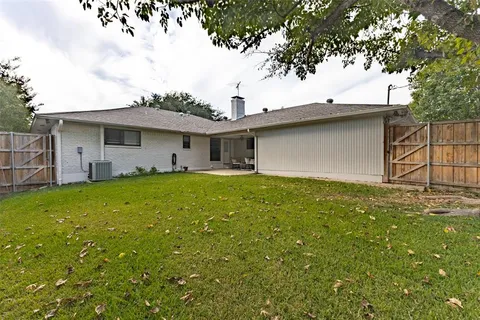 a front view of house with yard and outdoor seating