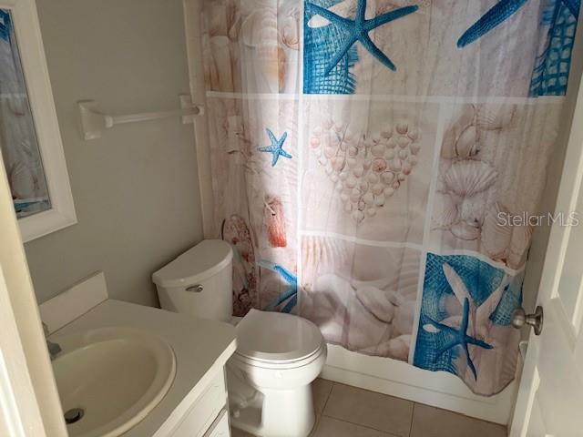 24540 Harbor View Road, Unit H2 Punta Gorda, FL 33980 - Photo 15 of 21 a white toilet sitting next to a bath tub and a shower