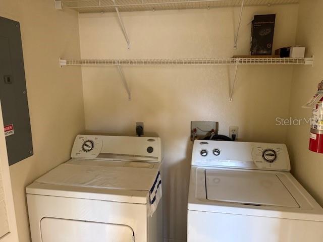 24540 Harbor View Road, Unit H2 Punta Gorda, FL 33980 - Photo 16 of 21 a utility room with dryer and washer