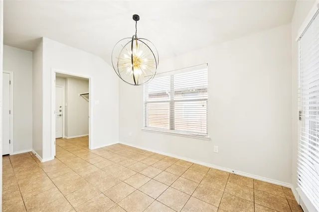 a large kitchen with a large counter top appliances and cabinets