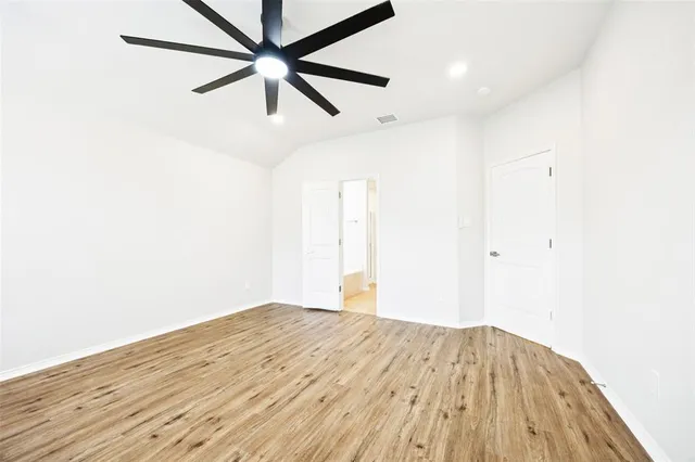 a bathroom with a tub sink and a mirror