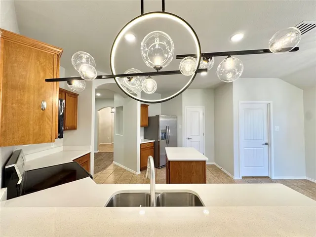 a bathroom with a sink a mirror and a shower