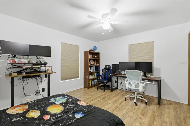 a bedroom with a bed and a chair