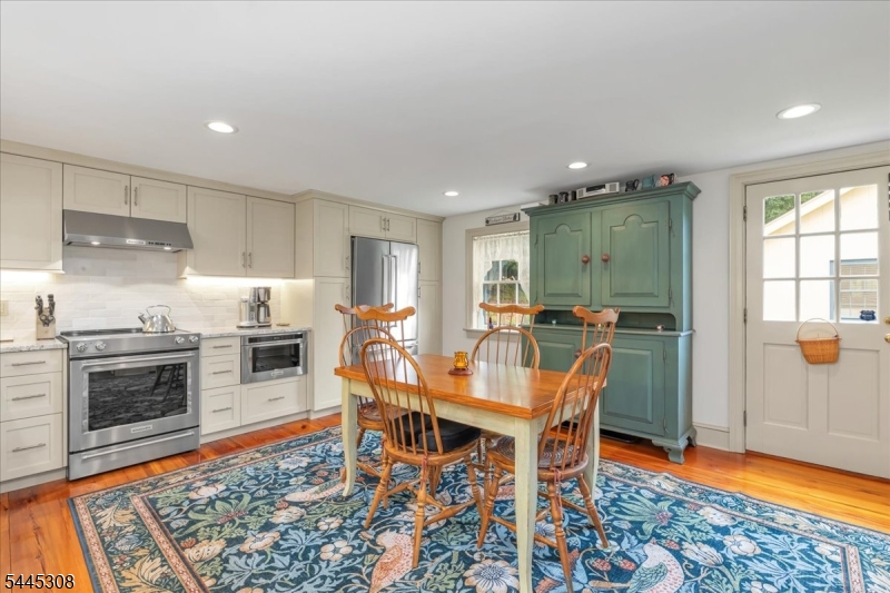 911 Ravine Road Port Murray, NJ 07865 - Photo 13 of 50 a view of a dining room with furniture and wooden floor