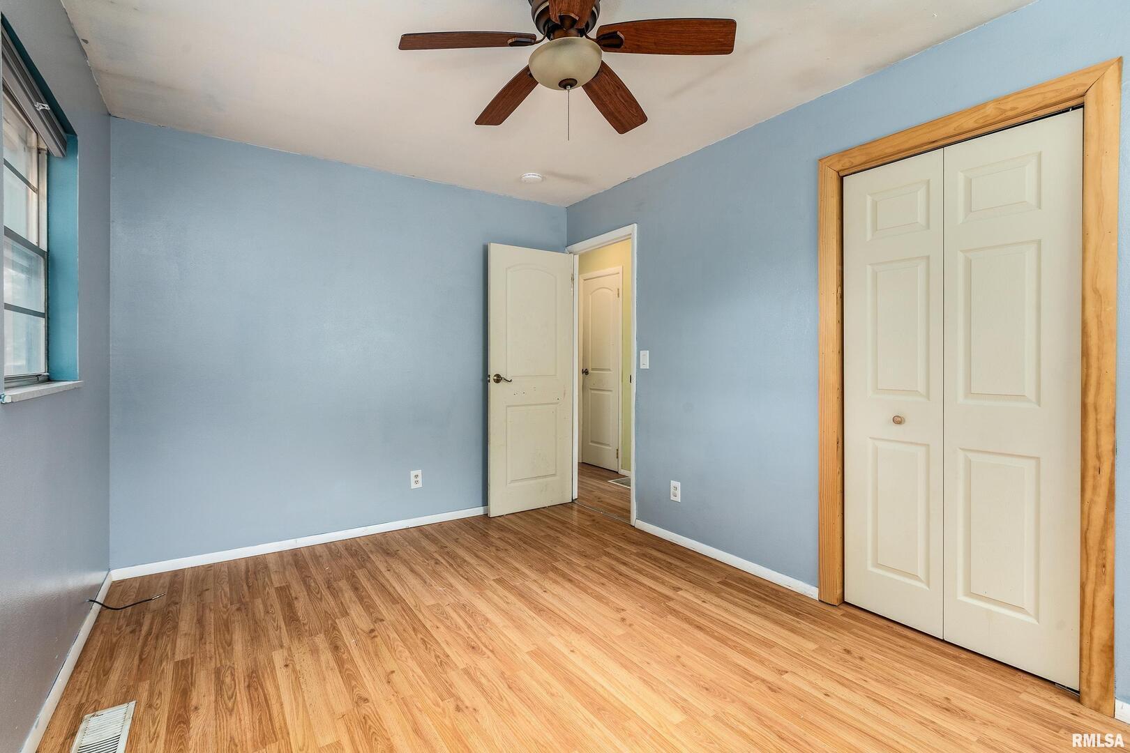 309 South Plover Drive Carbondale, IL 62901 - Photo 11 of 29 a view of empty room with wooden floor and ceiling fan