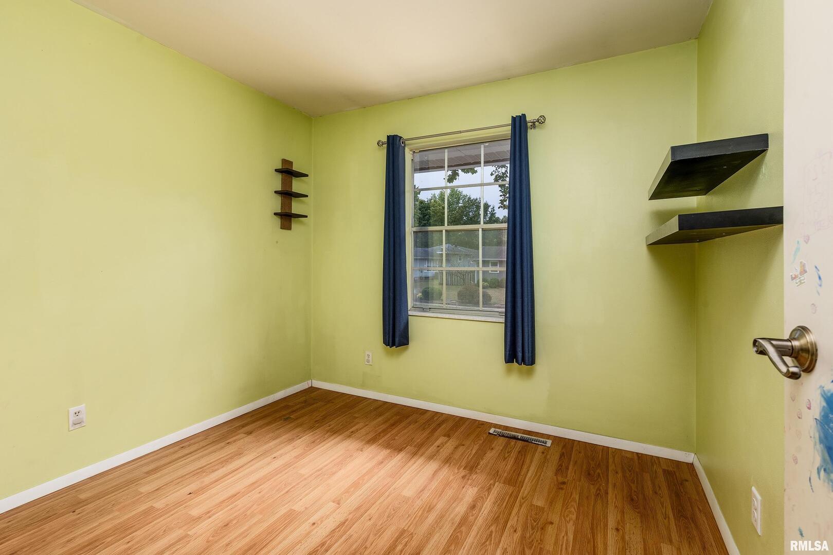 309 South Plover Drive Carbondale, IL 62901 - Photo 15 of 29 a view of a room with wooden floor and a window