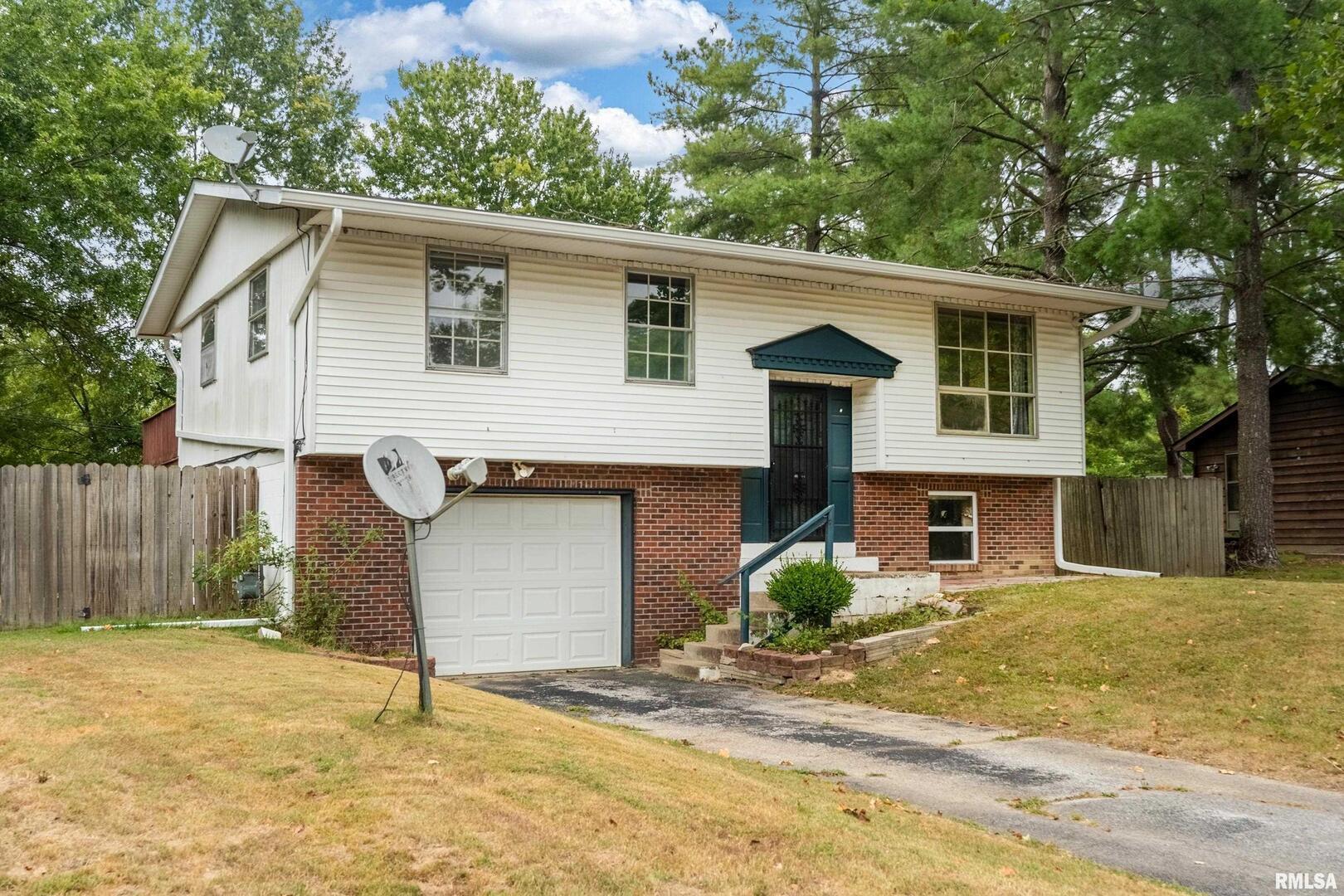 309 South Plover Drive Carbondale, IL 62901 - Photo 29 of 29 a view of a house with a yard and large tree