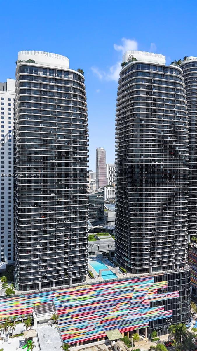 45 Southwest 9th Street, Unit 3306 Miami, FL 33130 - Photo 2 of 21 a front view of a building with glass windows