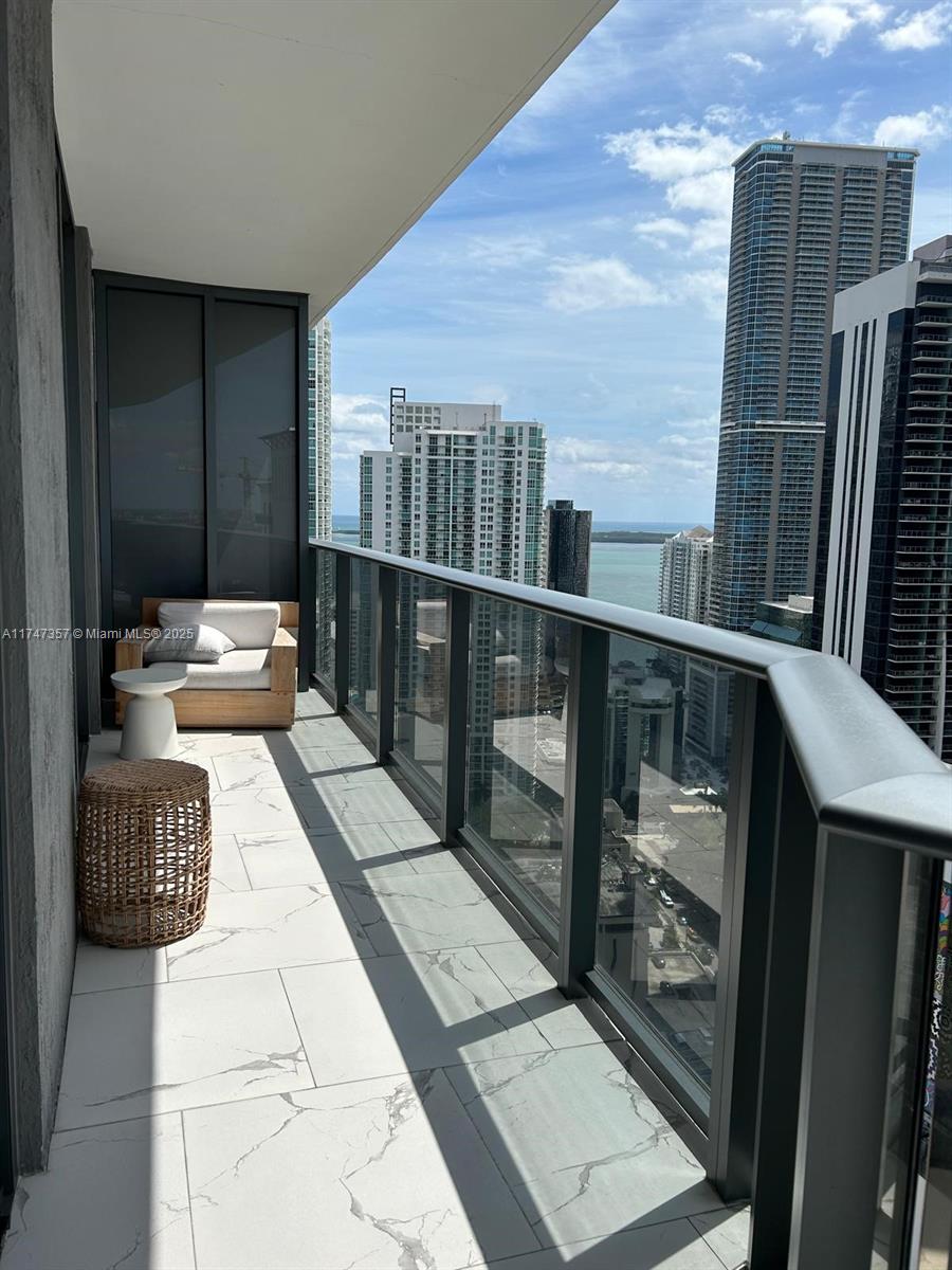 45 Southwest 9th Street, Unit 3306 Miami, FL 33130 - Photo 21 of 21 a balcony with furniture