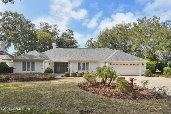 a view of a house with a back yard