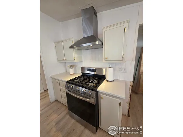 a kitchen with a stove and a microwave