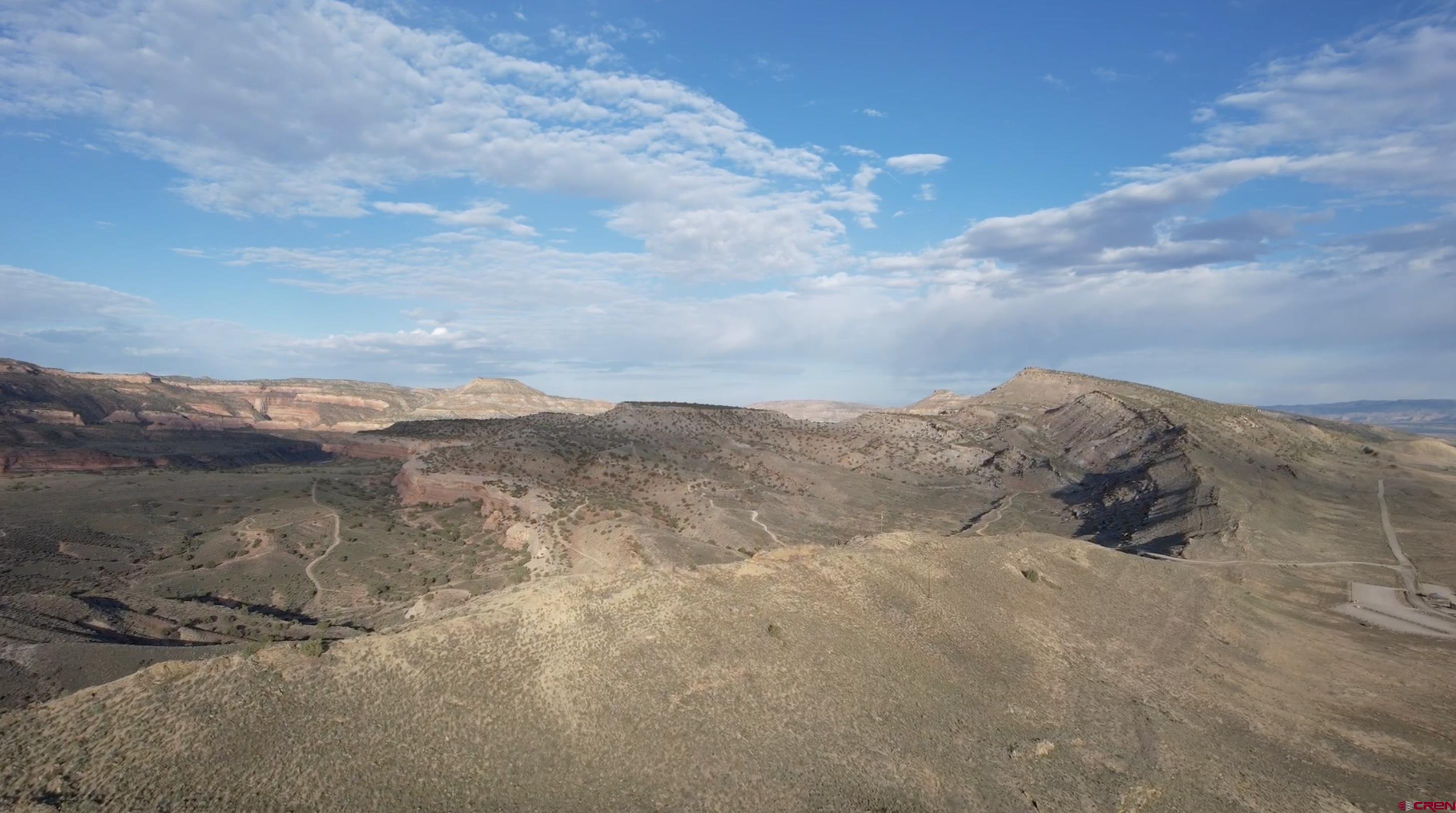 1275 Hawkeye Road Loma, CO 81524 - Photo 2 of 9 a view of a lake with mountains in the background