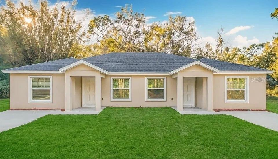 a view of a house with a yard