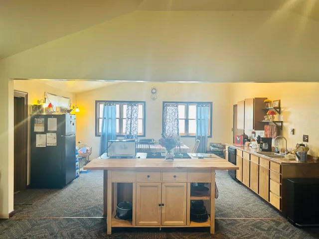 a spacious bathroom with a granite countertop sink and a mirror