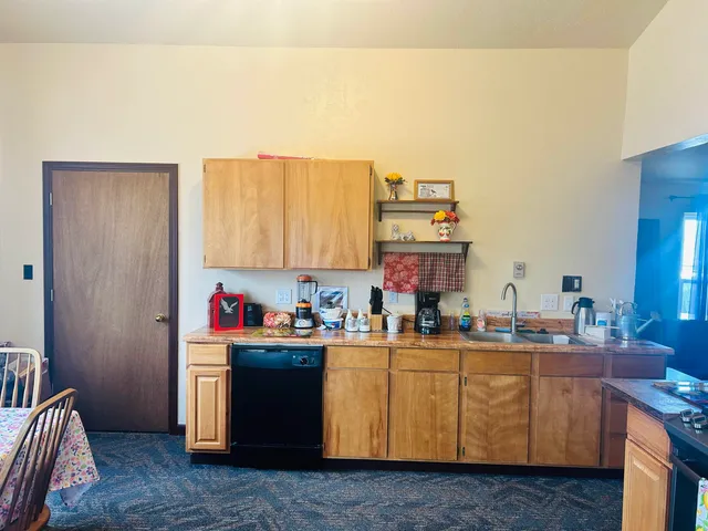 a room with a sink cabinets and utility room