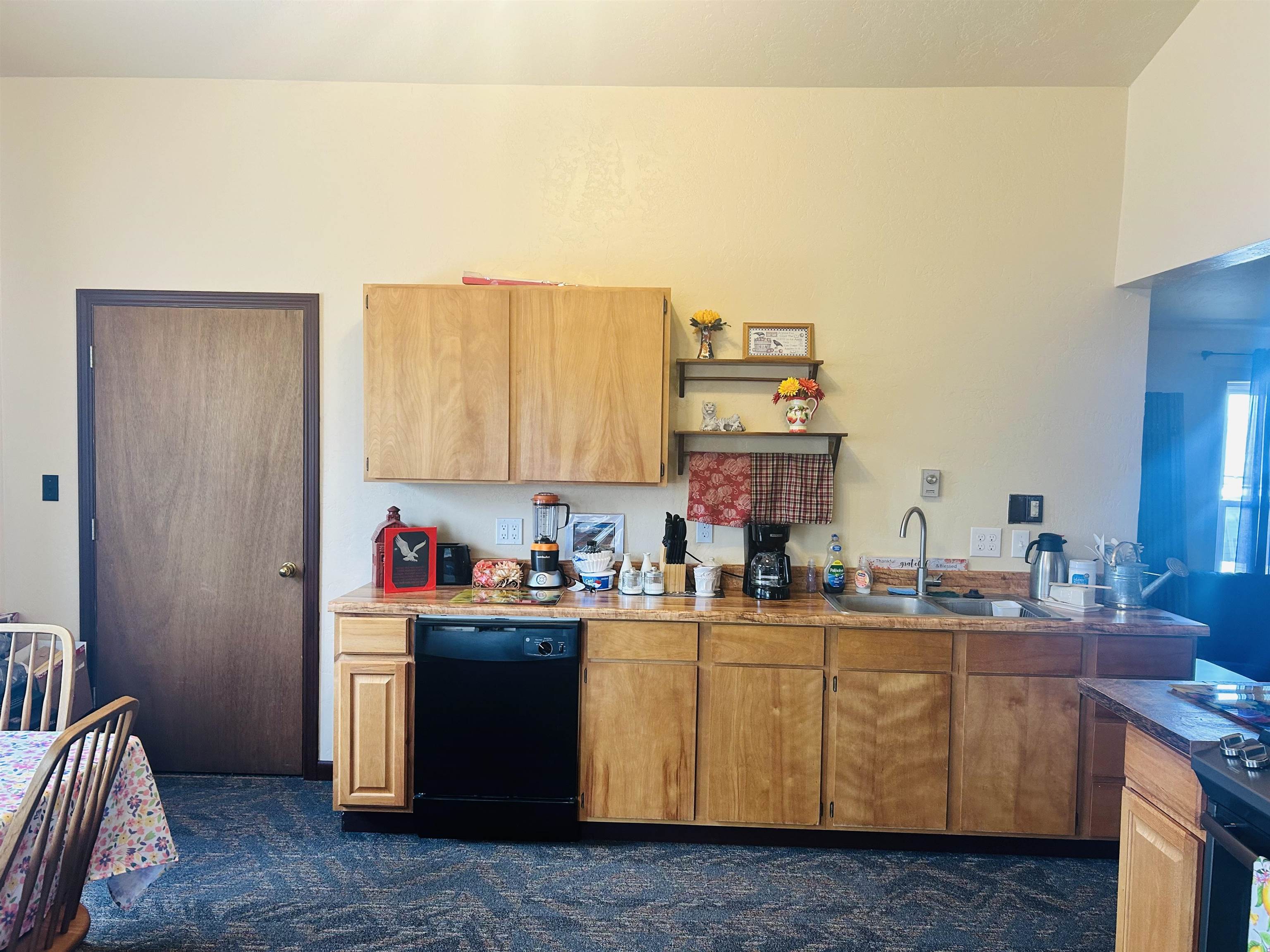 49067 KE Road Mesa, CO 81643 - Photo 13 of 31 a room with a sink cabinets and utility room