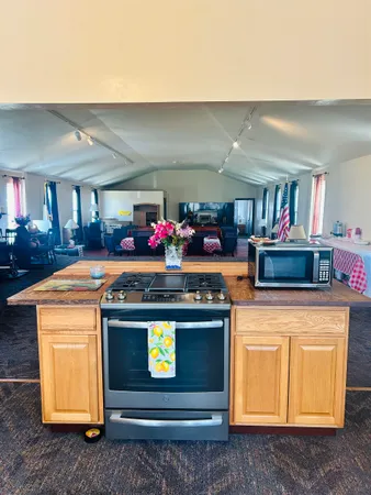 a kitchen with stainless steel appliances granite countertop a stove and a cabinets