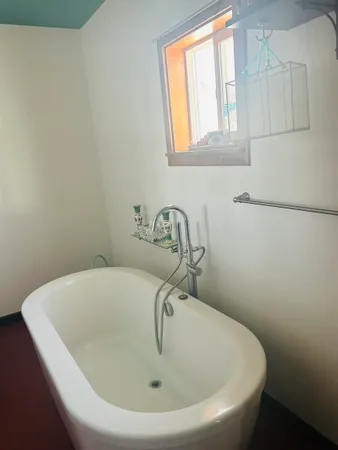 a white bath tub sitting in a bathroom