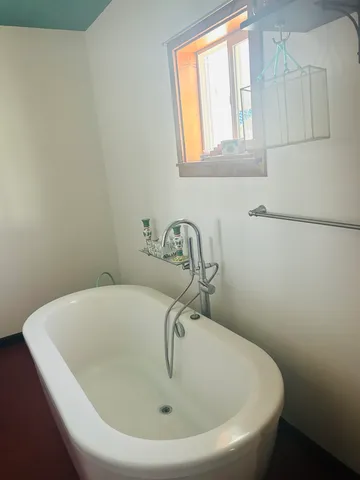 a white bath tub sitting in a bathroom