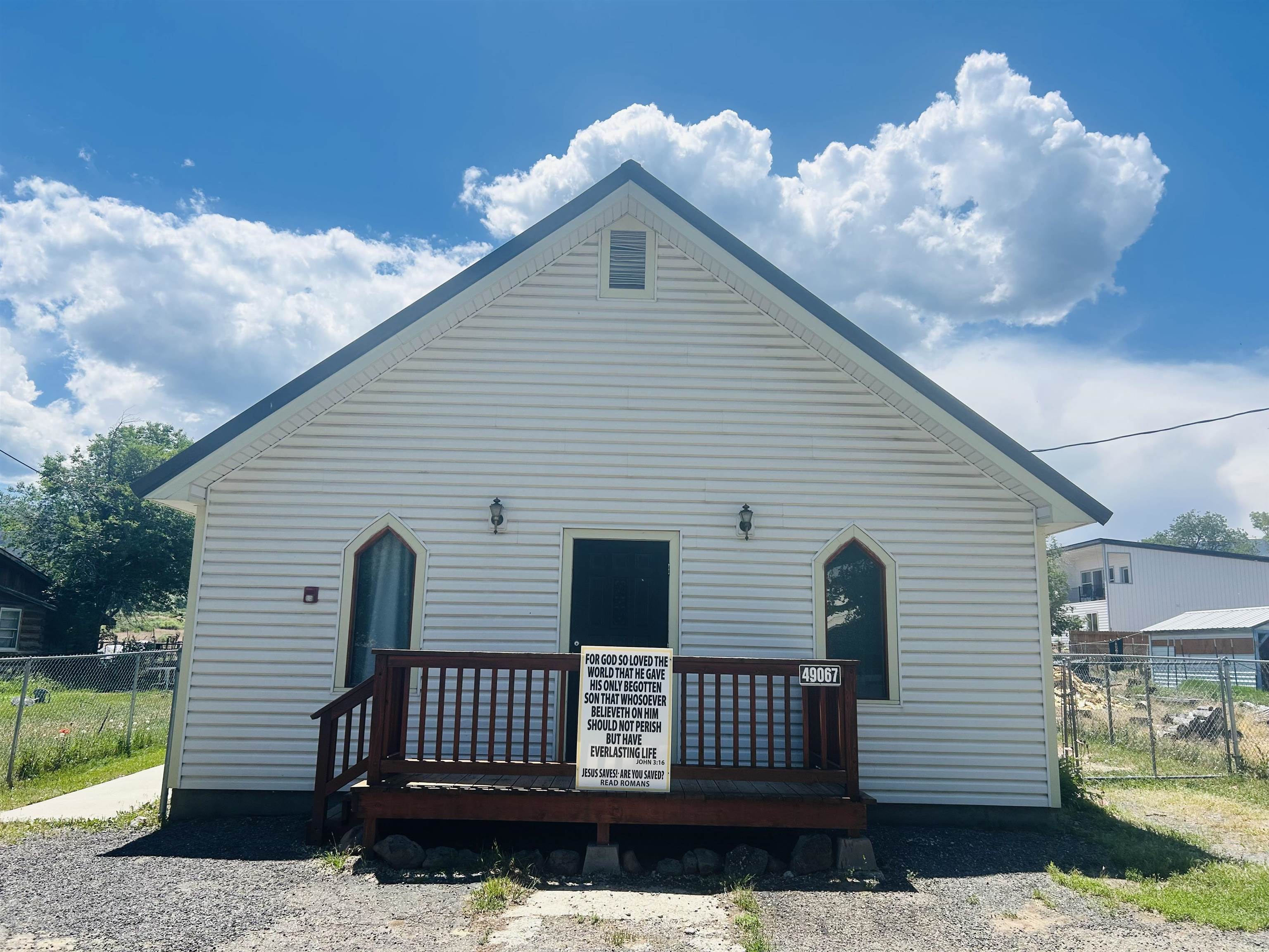 49067 KE Road Mesa, CO 81643 - Photo 2 of 31 a front view of a house with a garden