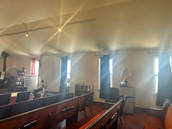 a view of a lobby area with furniture and wooden floor